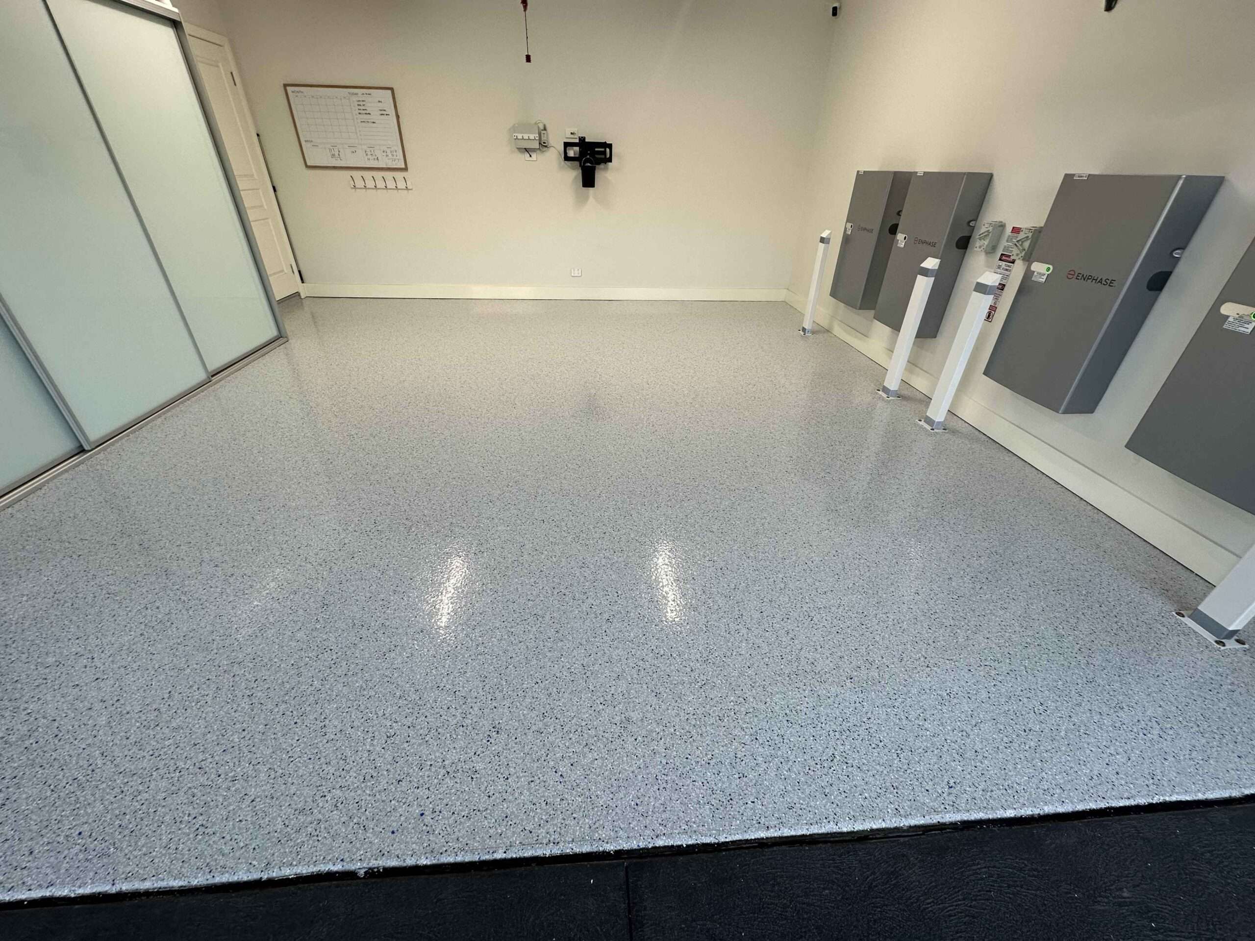 EV charger garage with light grey flake epoxy flooring in Sydney
