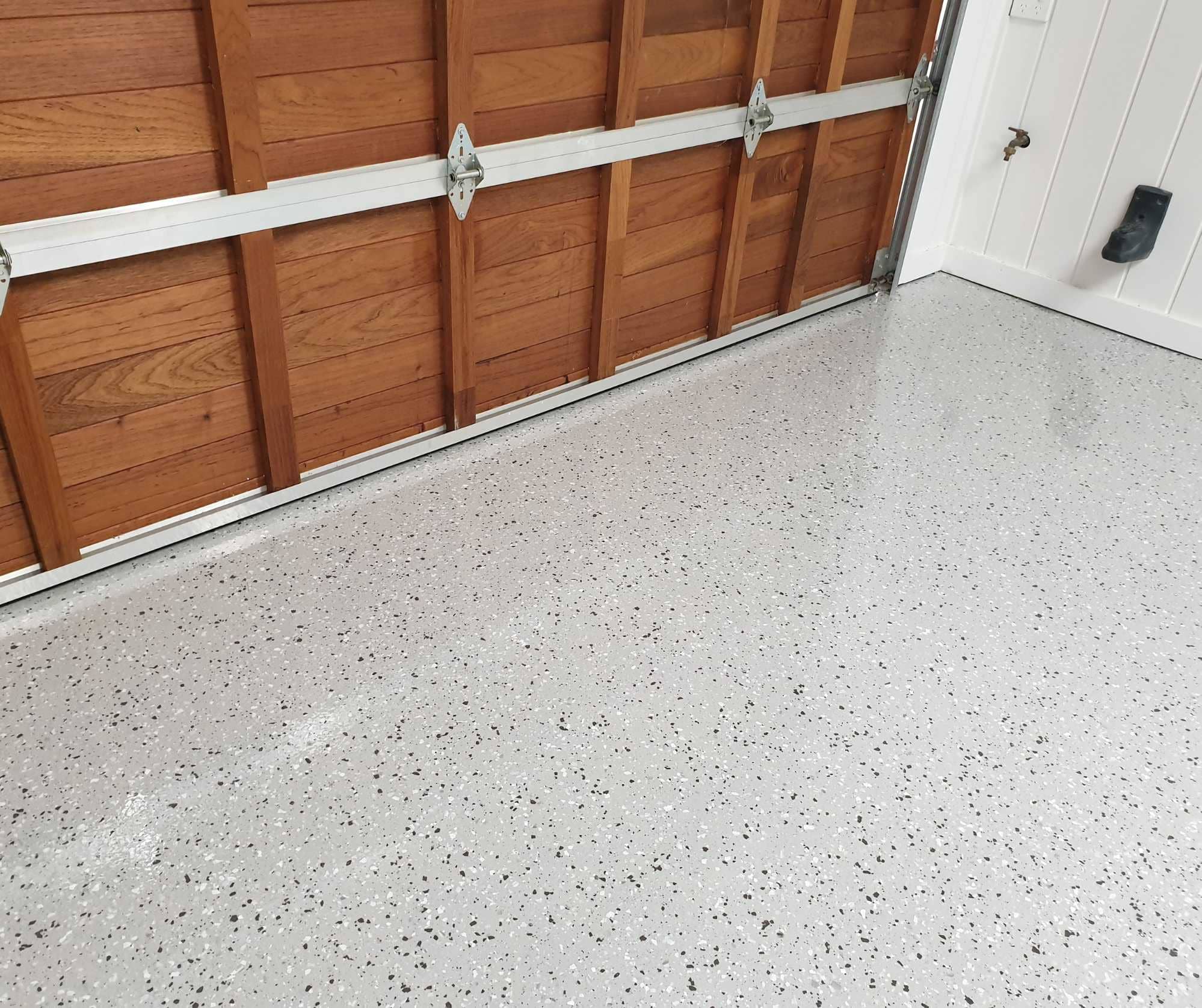 Partial flake epoxy garage flooring in Sydney with light grey finish
