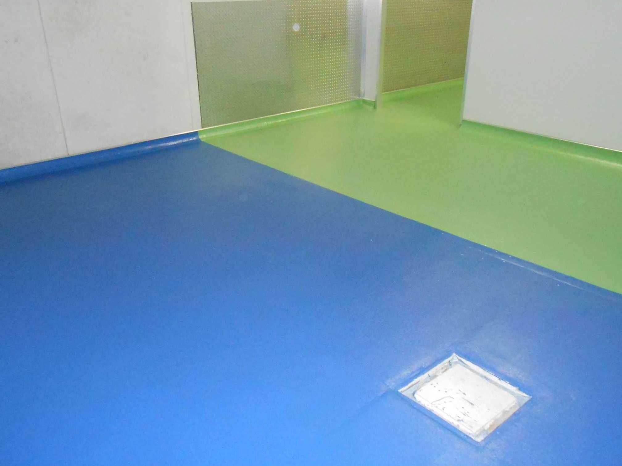 Commercial kitchen epoxy coving with blue and green seamless floor in Sydney