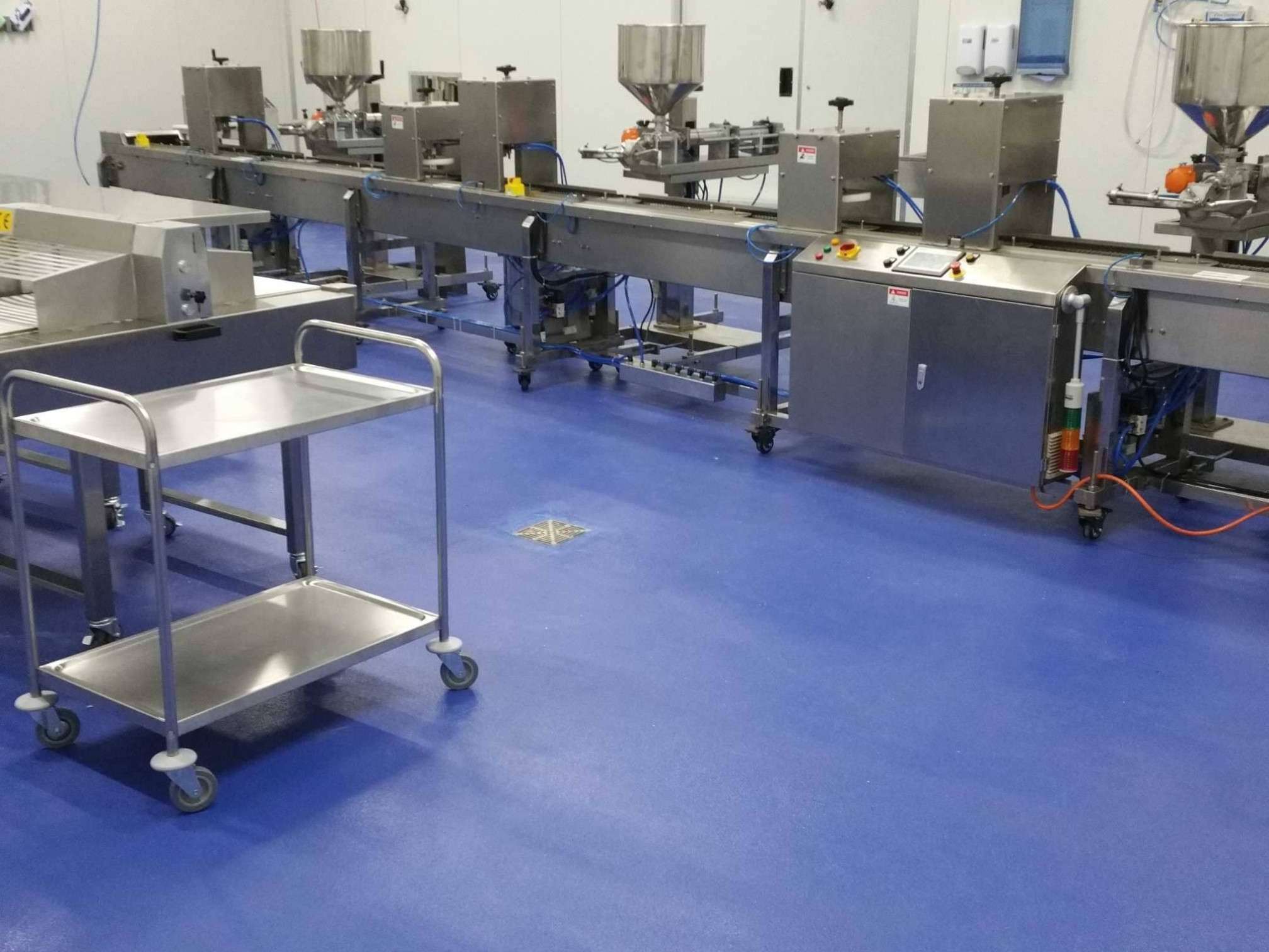 Epoxy flooring in food production facility with processing equipment in Sydney