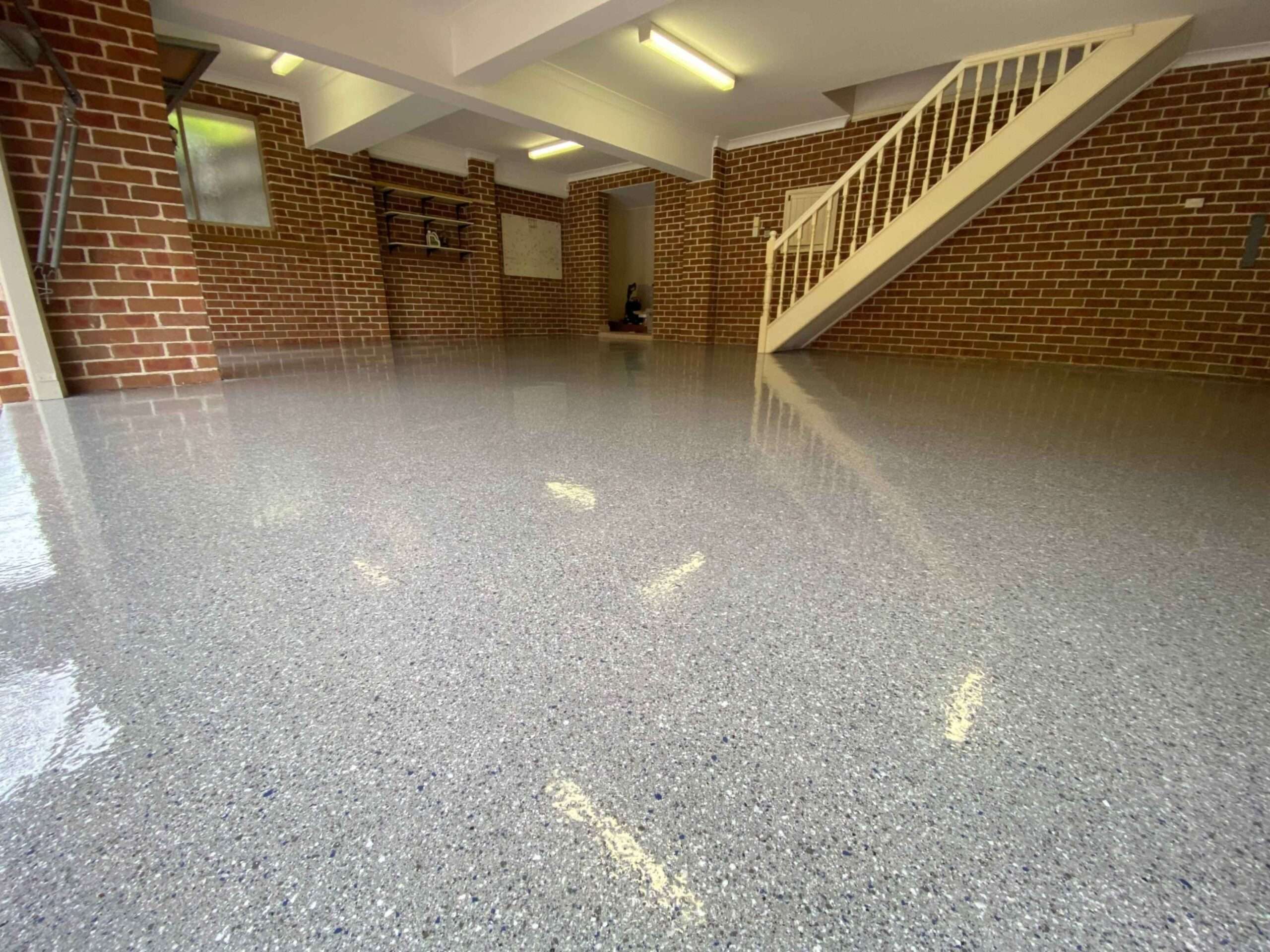 Gloss grey flake garage epoxy flooring in Sydney residential garage