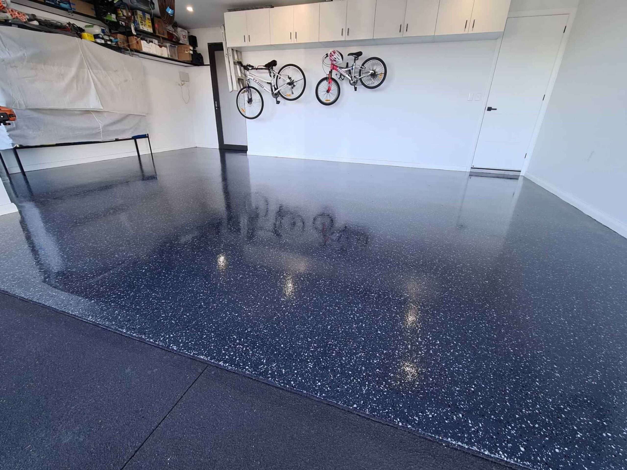 Large grey flake garage epoxy flooring in Sydney residential property